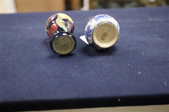 A small Moorcroft wisteria pattern vase and a Macintyre bottle vase